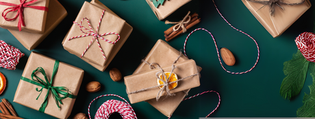 garlan with natural decor announcing a holiday market
