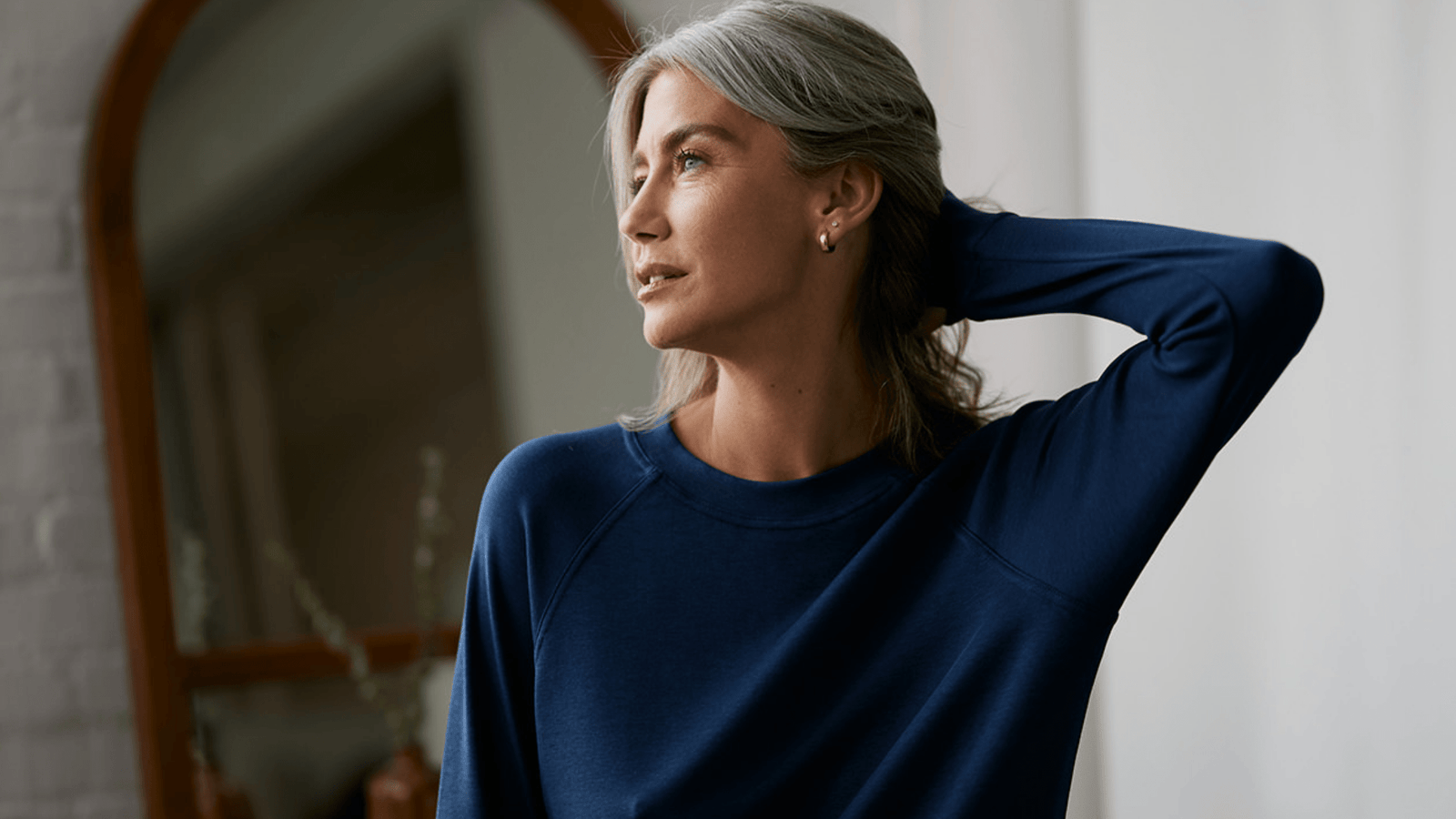 woman wearing blue loungewear sweatshirt