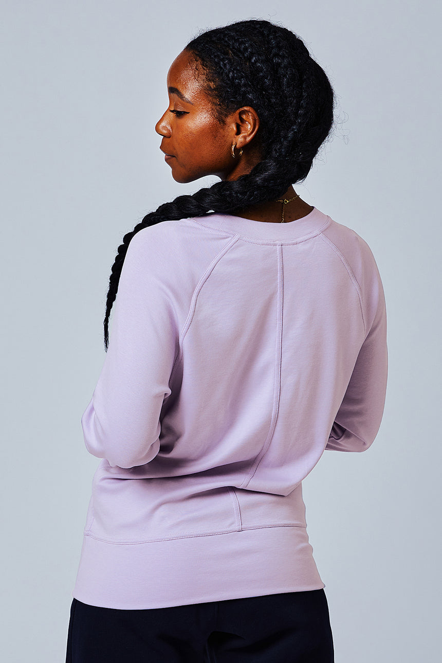 Woman wearing loungewear crewneck sweatshirt made from sustainable TENCEL and organic cotton in Digital Lavender - 7