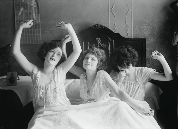 Photo of women wearing sleepwear pajamas in bed