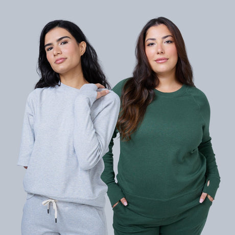 two women standing side by each wearing hernest project loungewear sets in green and heather grey