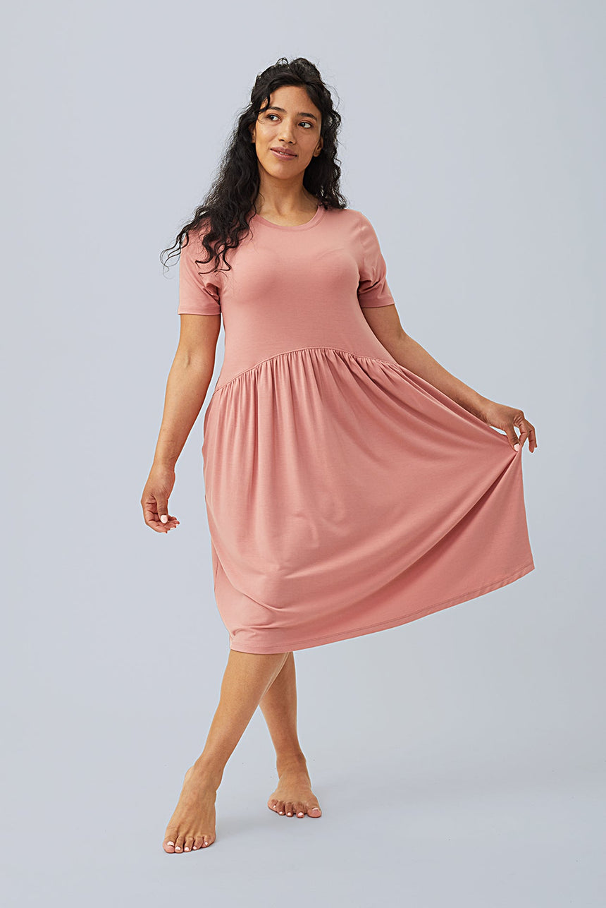 woman wearing lounge dress loungewear in light pink