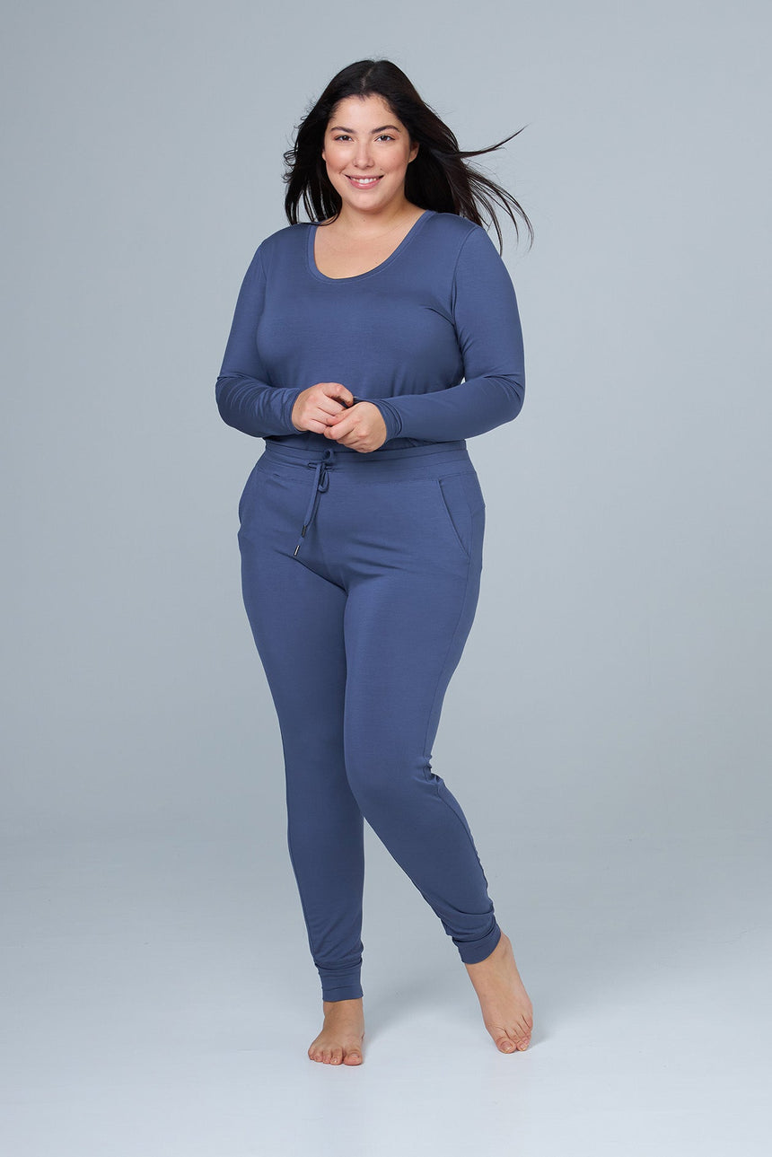 woman wearing blue lounge pants and blue sleep shirt