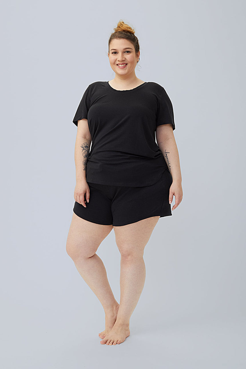 woman wearing black tencel cotton lounge shorts and black tshirt 