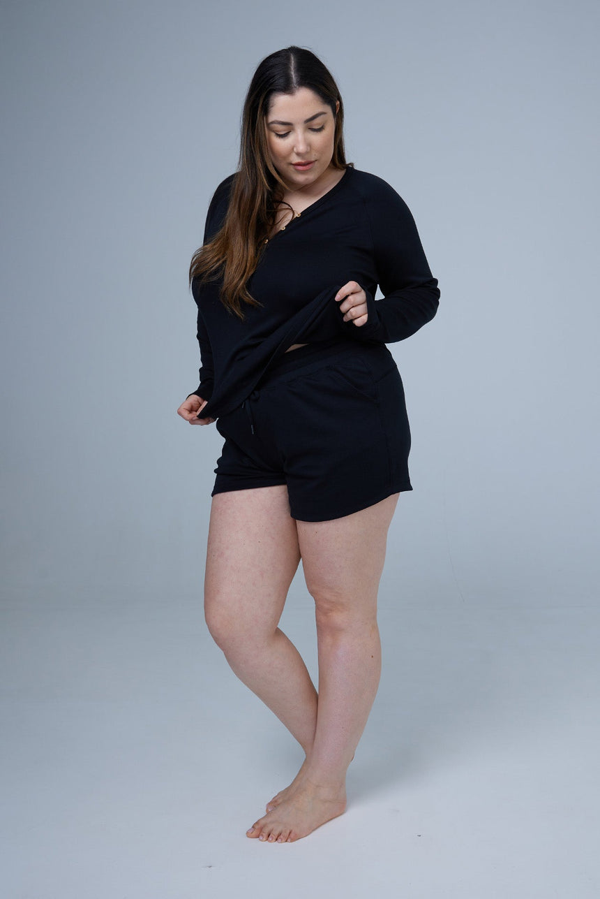 woman wearing black tencel cotton lounge shorts and black tshirt