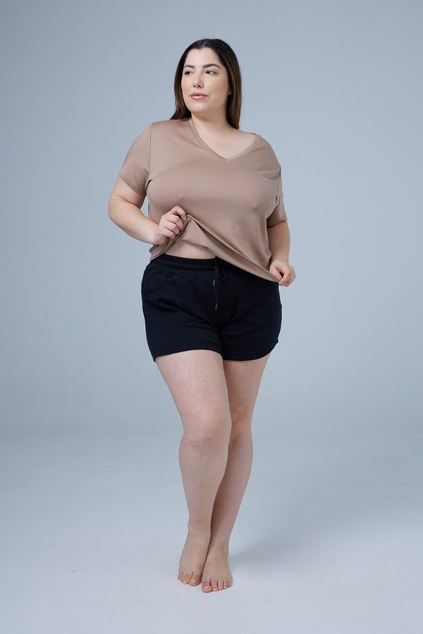 woman wearing black tencel cotton lounge shorts and lounge shirt