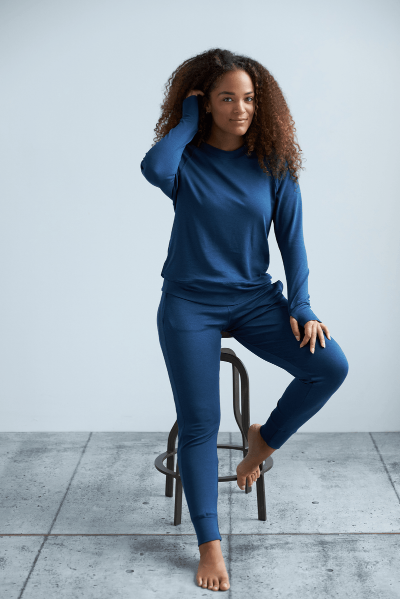 Woman wearing loungewear crewneck sweatshirt made from sustainable TENCEL and organic cotton in blue 9