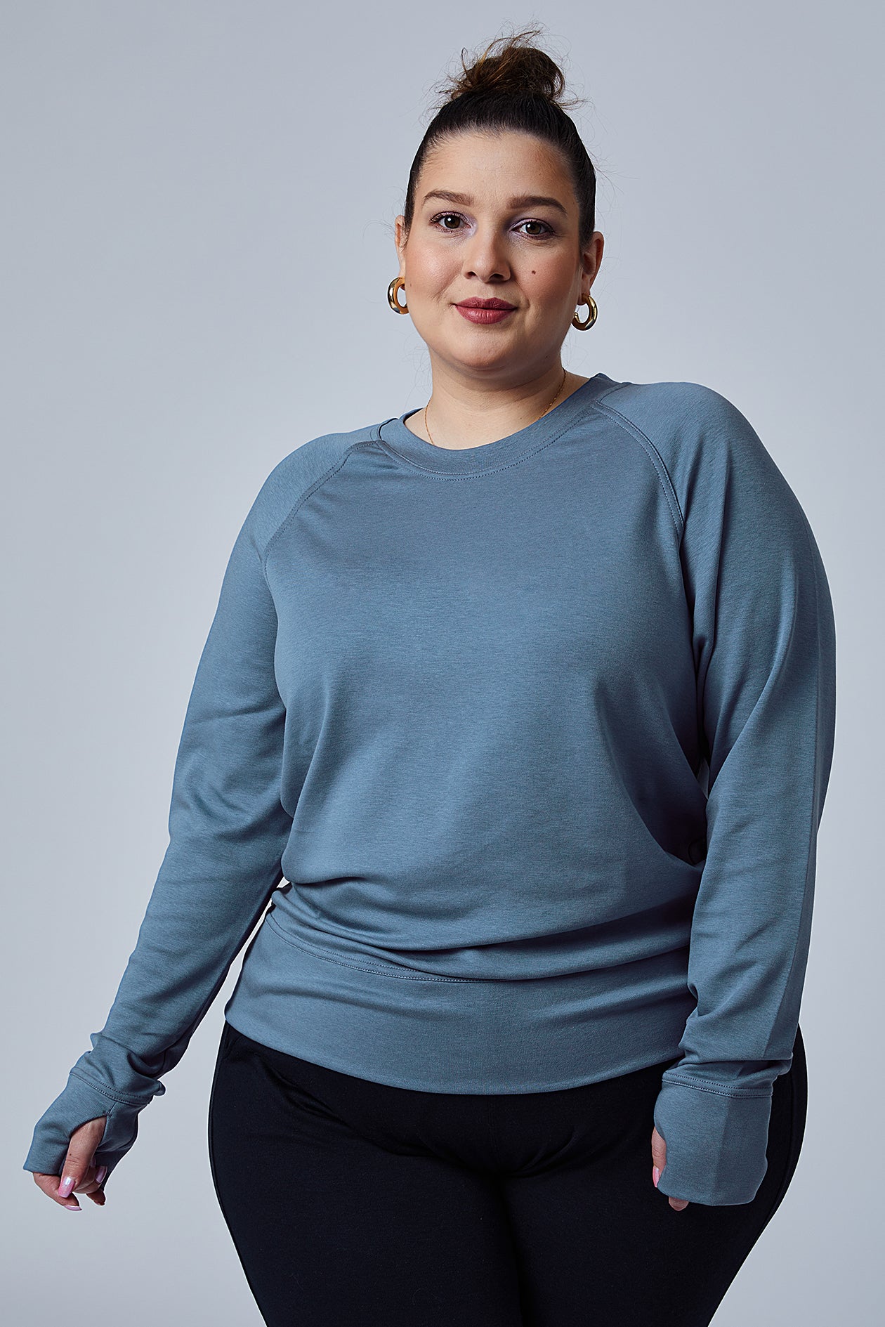Woman wearing loungewear crewneck sweatshirt made from sustainable TENCEL and organic cotton in Coronet Blue - 3