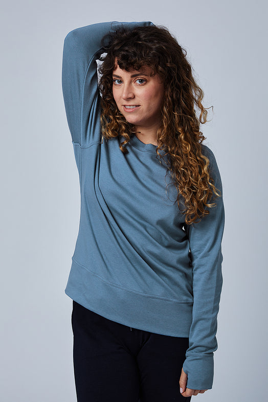 Woman wearing loungewear crewneck sweatshirt made from sustainable TENCEL and organic cotton in Coronet Blue - 5