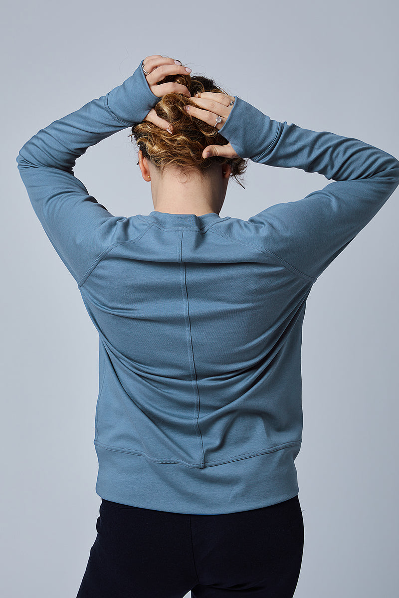 Woman wearing loungewear crewneck sweatshirt made from sustainable TENCEL and organic cotton in Coronet Blue - 6