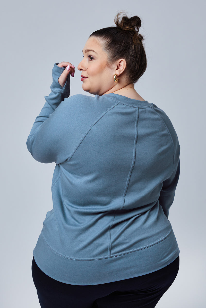 Woman wearing loungewear crewneck sweatshirt made from sustainable TENCEL and organic cotton in Coronet Blue - 2
