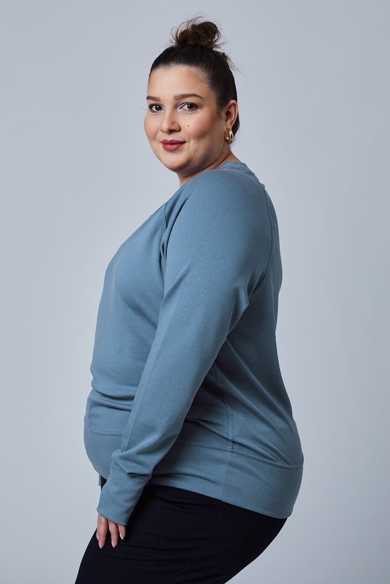 Woman wearing loungewear crewneck sweatshirt made from sustainable TENCEL and organic cotton in Coronet Blue - 4